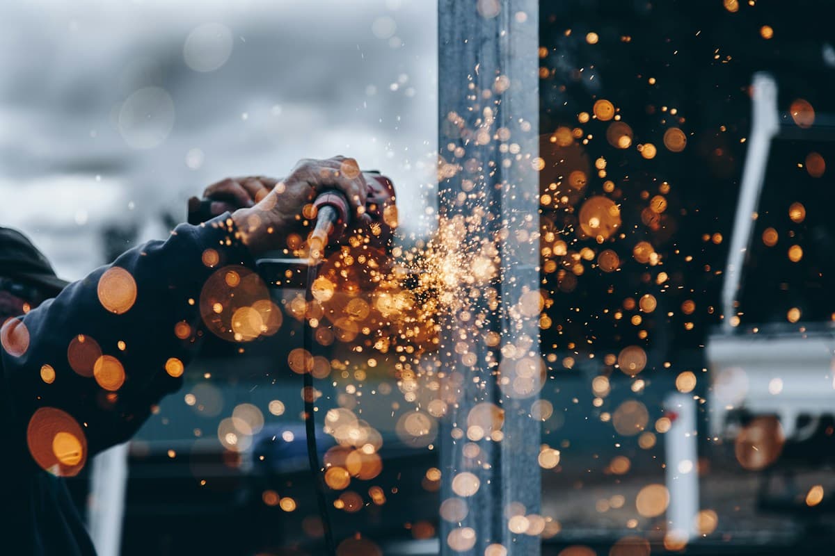 Metalworking in a workshop, illustrative editorial photograph